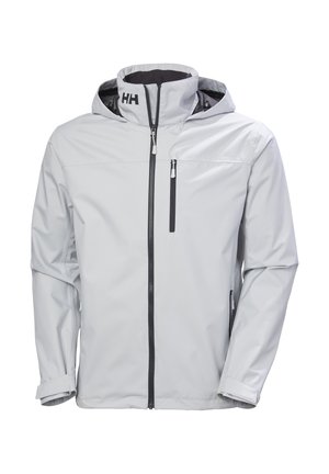 Lichtgrijze waterdichte jas met een ritssluiting aan de voorkant, een verstelbare capuchon en zwarte accenten. Heeft een borstzak en elastische manchetten.