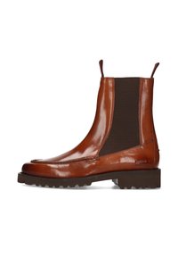 Stivali Chelsea in pelle marrone con pannelli laterali elasticizzati, suola in gomma robusta e finitura liscia e lucida. Cuciture decorative lungo la punta.