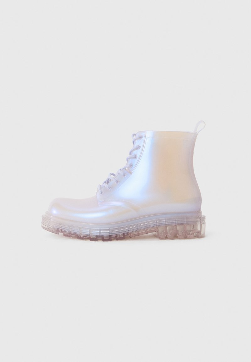 Transparent ankle boots with a glossy finish, featuring a lace-up design and a chunky, translucent sole with treaded pattern.