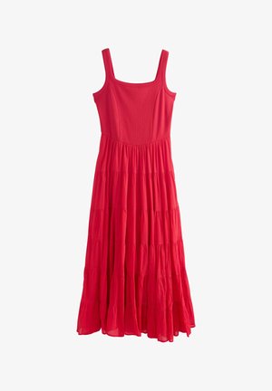 Sleeveless red maxi dress with fitted bodice and tiered, flowing skirt made of lightweight fabric.