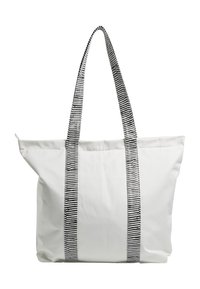 White canvas tote bag with black striped handles, featuring a spacious design and a top closure for secure storage.