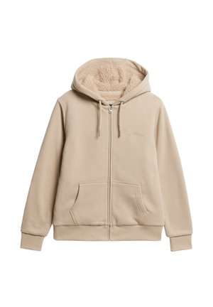 Haut à capuche beige avec fermeture éclair sur le devant, cordons de serrage et doublure en peluche texturée. Comprend des poches kangourou et des poignets et un ourlet côtelés.