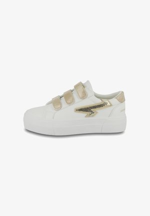 White platform sneakers with gold accents, featuring three hook-and-loop straps, a textured lightning bolt design, and smooth synthetic material.