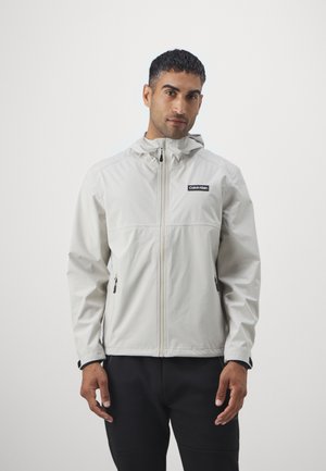 Calvin Klein Golf FEATHER DRY WATERPROOF SHELL JACKET - Sadetakki - sand