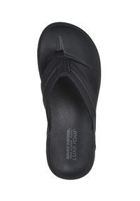 Zwarte slipper gemaakt van zacht luxe schuim, met een gestructureerde voetbed, brede banden en een minimalistisch ontwerp. Gedetailleerd met logo op het voetbed.