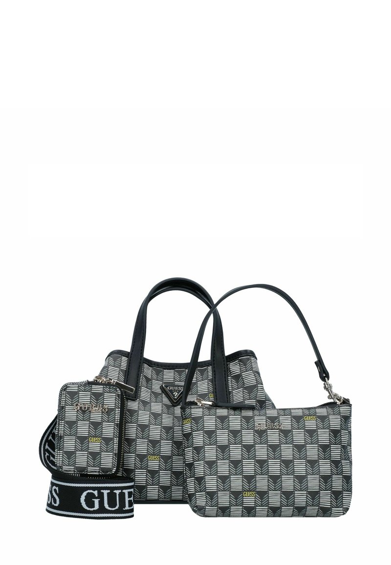 Trois sacs dans un motif géométrique ; le sac principal est noir avec des accents gris et blancs, doté de sangles en cuir. Comprend une petite pochette et une sangle réglable.