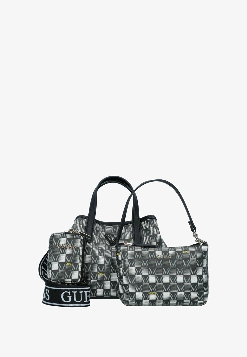 Trois sacs dans un motif géométrique ; le sac principal est noir avec des accents gris et blancs, doté de sangles en cuir. Comprend une petite pochette et une sangle réglable.