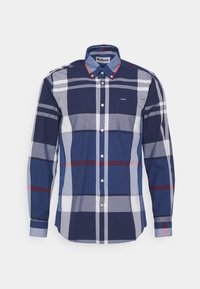 Marineblauw geruit overhemd met lange mouwen, knoopsluiting aan de kraag en borstzak. Heeft afwisselend lichtblauwe, witte en rode strepen.