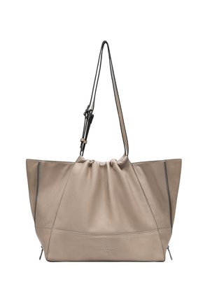 Beige Ledertasche mit einem lässigen Design, Kordelzugverschluss und schwarzen Akzenten. Verfügt über eine seitliche Reißverschlusstasche und eine glatte Textur.