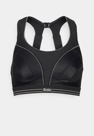 Sort sportsbh med et struktureret design, mesh-paneler, justerbare stropper og et mærket elastisk bånd. Har refleksive accenter.