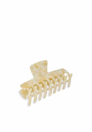Crèmekleurige haarclauw gemaakt van duurzaam plastic, met een gemarmerd patroon, acht grip tanden en een afgeronde topontwerp.