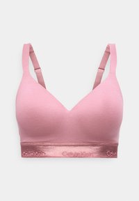 Ομαλός ροζ επενδεδυμένος στηθόδεσμος με ρυθμιζόμενους ιμάντες και μεταλλική ταινία με το λογότυπο Calvin Klein γύρω από τη βάση.