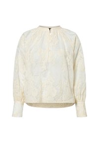 Blusa crema con ricami floreali, collo rotondo, patta con bottoni e maniche lunghe con polsini elastici. Texture morbida e vestibilità ampia.