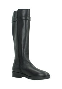 Botte en cuir noir montante avec une fermeture éclair latérale et un design minimaliste. Elle dispose d'une semelle plate et d'une finition lisse. Accentuée par une petite sangle.