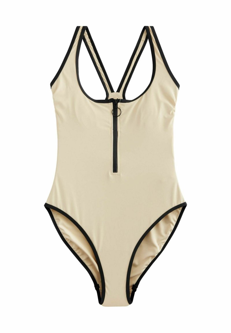 Maillot de bain une pièce beige avec fermeture éclair à l'avant, bord noir, dos en ronde et bretelles entrecroisées. Fabriqué en tissu lisse et extensible.