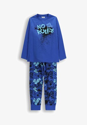 Niebieska bluzka z długim rękawem z napisem "BEZ ZASAD JEDŹMY NA DESCE" oraz pasujące spodnie pokryte graffiti i wzorami rozprysków atramentowych.