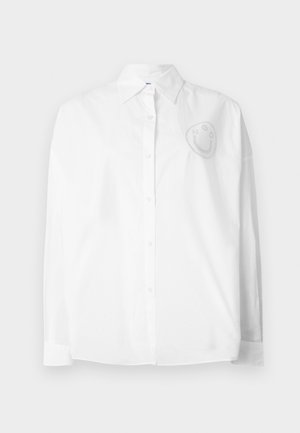 White button-up shirt with a classic collar, long sleeves, and a smiley face design embroidered on the left chest area.
