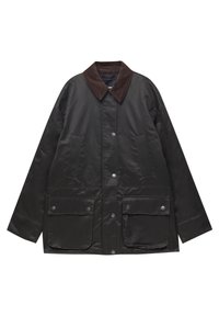 Veste noire cirée avec col en velours côtelé marron, boutons-pression à l'avant, deux poches à rabat avec boutons-pression et deux poches latérales verticales.