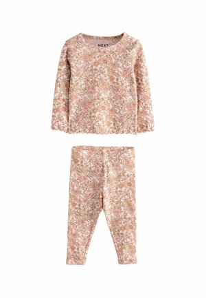 Ensemble deux pièces à motif floral comprenant un haut à manches longues et un legging assorti, dans des couleurs rose doux et crème, fabriqué en matière extensible.