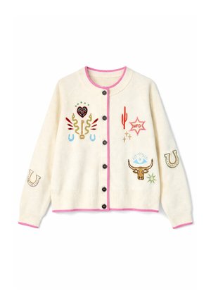 Krämfärgad kofta med svarta knappar, rosa kant och färgglada broderade motiv inklusive en kaktus, nyckel, hästsko, stjärnflagga och tjurhuvud.