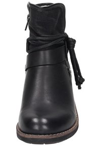Black ankle boots made of smooth leather with a textured fabric top. Features a side zipper, a tied lace detail, and a round toe.