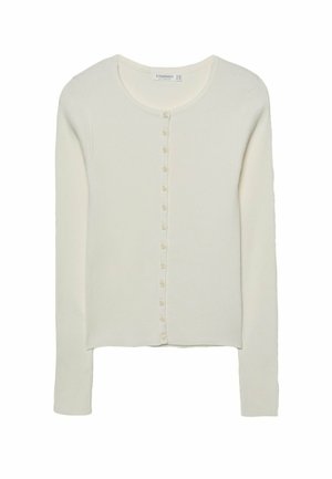 White ribbed cardigan featuring long sleeves, a round neckline, and a button-down front with small, light-colored buttons.