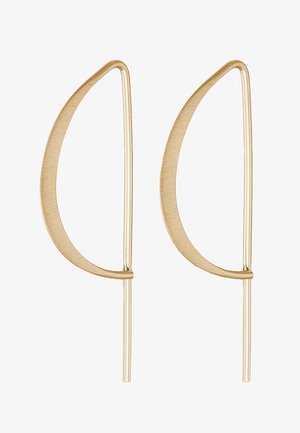 Gold metal earrings with a curved, elongated leaf shape. The surface is smooth and matte, featuring thin horizontal accents.