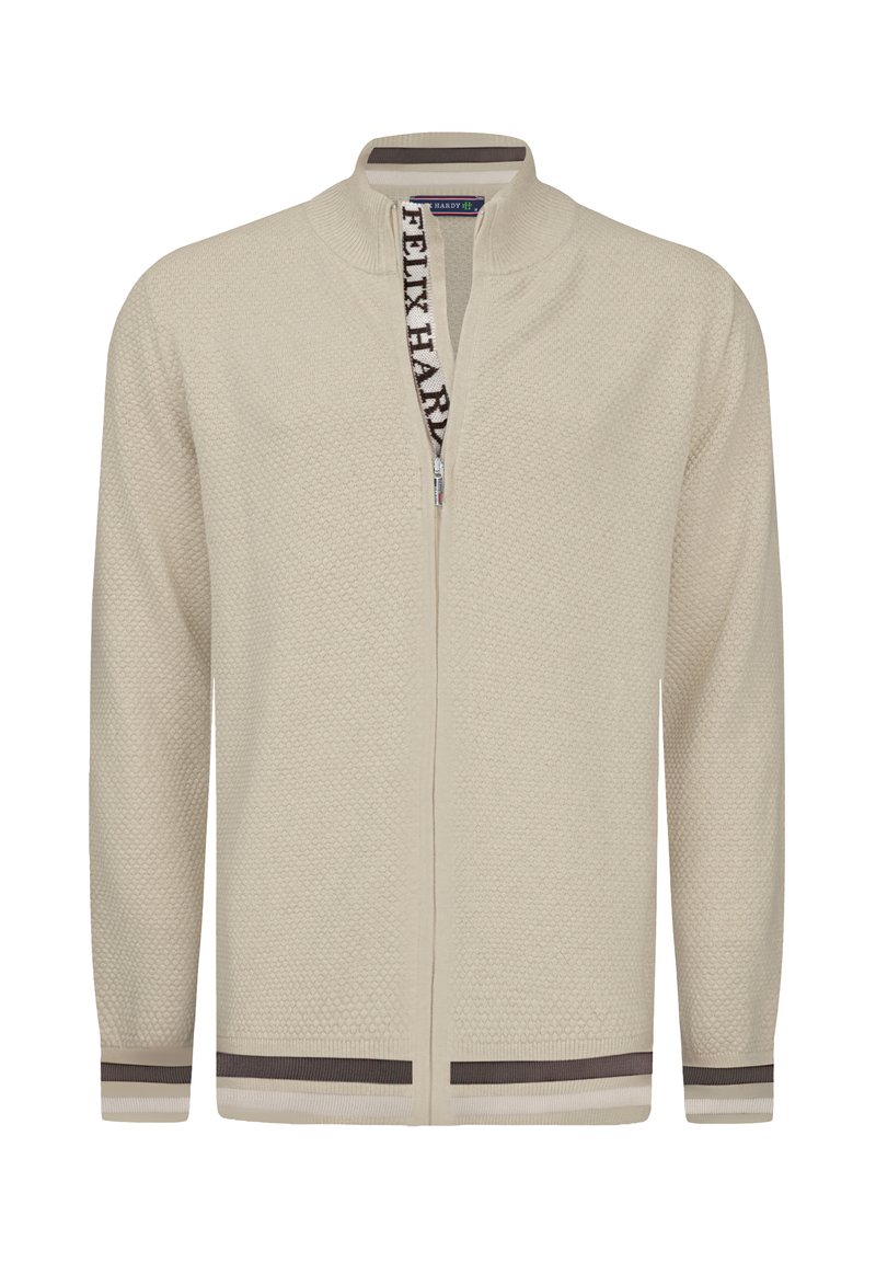 Cardigan beige con zip, realizzato in tessuto testurizzato, con colletto a coste e strisce di contrasto marroni su polsini e orlo. Presenta del nastro con logo sulla zip.