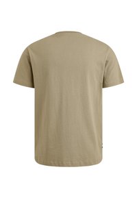 T-shirt en coton beige à manches courtes avec un col rond. Texture lisse et coupe décontractée. Aucun logo ni motif visible.