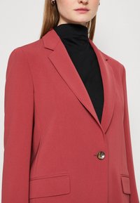 BOSS JOCALUAH - Puspaltis - red
