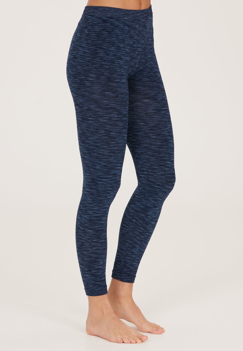 Marineblaueleggings mit strukturiertem Design, das hellblaue Streifen aufweist. Hoher Bund, taillierte Form, aus dehnbarem Material.