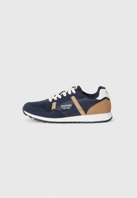 Navy blue and tan Jack & Jones sneaker with white laces and sole, side view on plain light gray background.