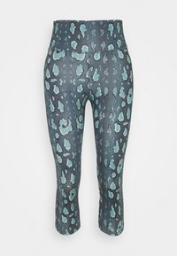Leggings tre quarti con un motivo scuro caratterizzato da macchie di azzurro chiaro. Realizzati in un tessuto elastico e liscio con una vita alta.