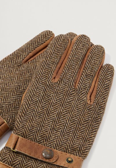 Brūni herringbone raksta vilnas cimdi ar brūnu ādas akcentiem, ietverot siksniņu un metāla aizdare detaļu. Strukturēta auduma un pieguļošs dizains.