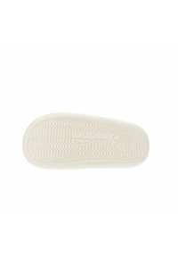 Suela de zapato de goma blanca con un patrón de banda de rodadura ondulante y marca en relieve, con una textura suave y bordes redondeados.