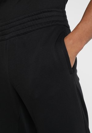 Pantalones deportivos - black