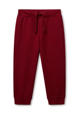 Burgunderfarbene Jogginghose aus weichem Baumwollstoff, mit elastischem Bund und Kordelzug, sowie schmal zulaufenden Bündchen an den Knöcheln.