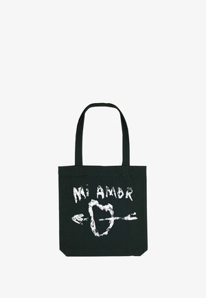 Sac fourre-tout noir en toile avec le texte blanc "Mi Amor" et un design de cœur avec une flèche. Tissu solide, deux anses.