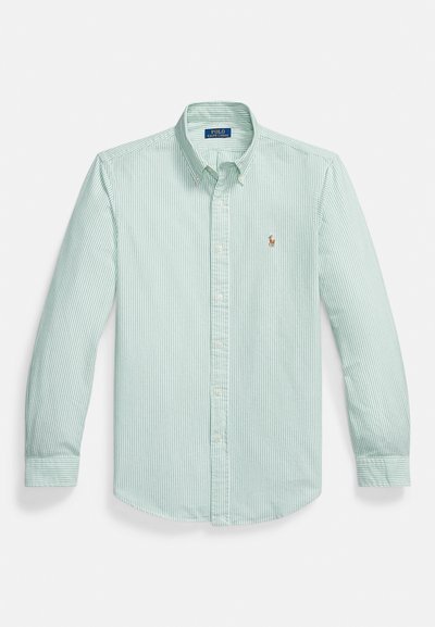 Light green button-down shirt featuring vertical white stripes, a pointed collar, and a small embroidered logo on the chest.