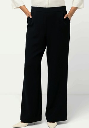Pantalones negros de pierna ancha hechos de una tela suave y ligera. Presenta bolsillos laterales y una cinturilla elástica cómoda.