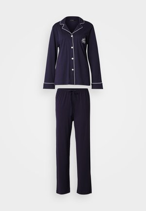 Marine bomulds pyjamasæt med long-sleeve knap-up top med hvid piping og en brystlomme, parret med bukser med elastisk talje.