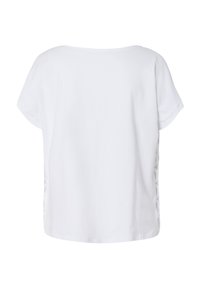 Witte t-shirt met korte mouwen en een relaxte pasvorm. Heeft een ronde halslijn en een decoratief uitsnijdontwerp aan de zijnaad. Glad textuur.