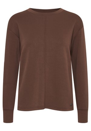 Brun langermet skjorte laget av mykt materiale med rund hals, senkede skuldre og en subtil sømdetalj foran.