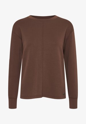 Ruda ilga rankovė palaidinė, pagaminta iš minkštos medžiagos, su apvaliu kaklu, sumažintomis pečių linijomis ir subtiliu siūlės akcentu priekyje.