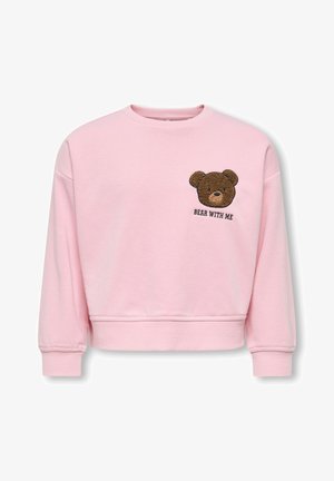 Sweatshirt rose clair à manches longues avec un ourlet côtelé. Présente un ours en peluche brun brodé sur la poitrine avec le texte "BEAR WITH ME".