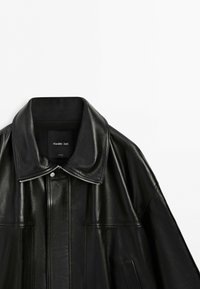 Black leather jacket with large collar, visible front zipper, and snap button, shown against a plain white background. Brand label reads Massimo Dutti.