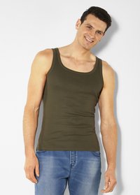 Olive green tank top with a round neckline, made from a smooth fabric, featuring a fitted design, worn with blue jeans.