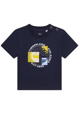 Granatowy bawełniany T-shirt z krótkim rękawem, ozdobiony dużą okrągłą grafiką drzewa oraz napisami "Timberland" i "Since 1973" w białych i żółtych akcentach.