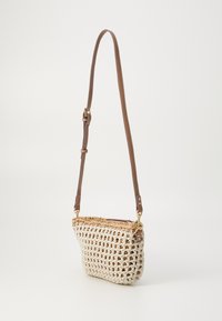 Woven handbag with a cream crochet body and a tan leather strap. Features a curved shape and gold hardware accents. Lightweight and compact.
