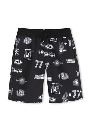 Shorts noirs avec des imprimés graphiques blancs incluant "BOSS", "Explore the World", "In the Making", le numéro "77" ainsi que des motifs de cactus et de timbre.